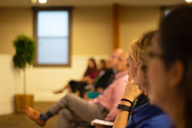 people listening to a presentation